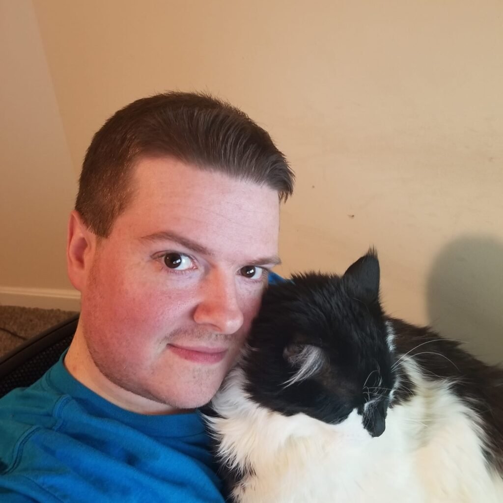 Image of the owner and his cat